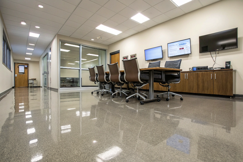 Office meeting room with anti-static epoxy flooring protecting sensitive technology equipment