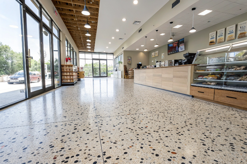 Decorative flake epoxy flooring system in retail store showing colored chip pattern and durable finish