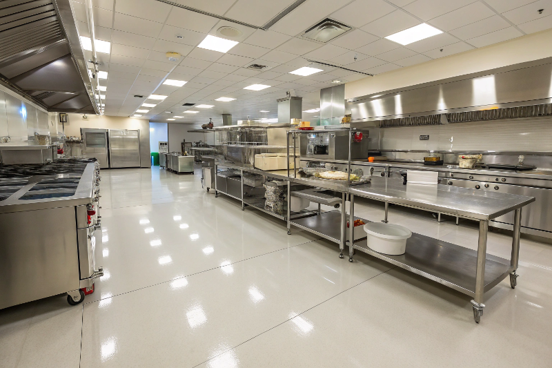 Modern commercial restaurant kitchen with seamless epoxy flooring installation in Sutherland Shire
